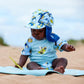 Baby trägt den UV Sonnenhut "Bugs Life" am Strand