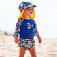 Mädchen am Strand trägt UV Sonnenhut und UV Schwimmanzug "Garden Delight"